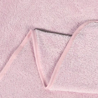 La texture de la cape de bain bébé