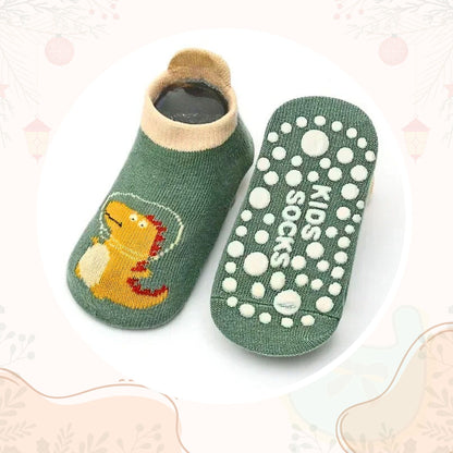 Chaussette antidérapante bébé Stepy™ motif dinosaure – protection et liberté de mouvement