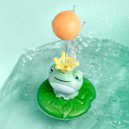 Le jouet de bain bébé MagikGrenouille™ avec balle tournante qui s’active grâce à la pression d’eau de sa couronne