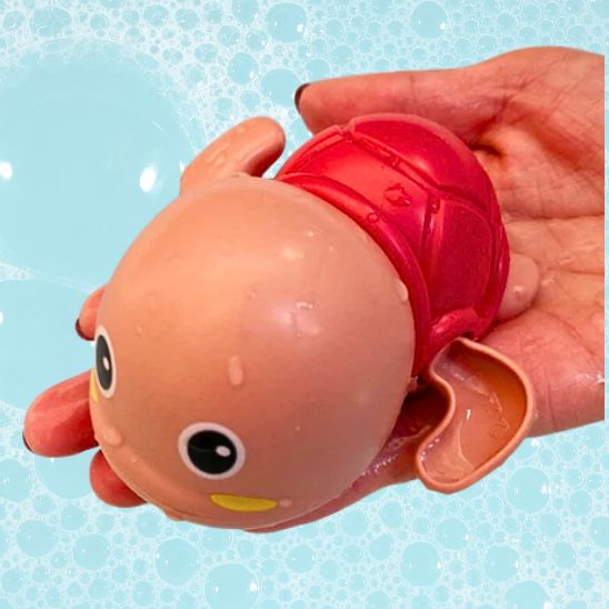 Jouet de bain bébé totue la nageuse rouge